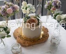 Artificial flowers, floating candles and wood