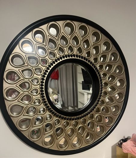 Beautiful black and gold round mirror with teardrop design!