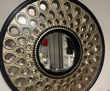 Beautiful black and gold round mirror with teardrop design!