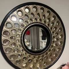 Beautiful black and gold round mirror with teardrop design!