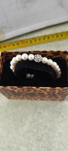 Boxed Jon Richard faux pearl stretch bracelet with a central crystal bead
