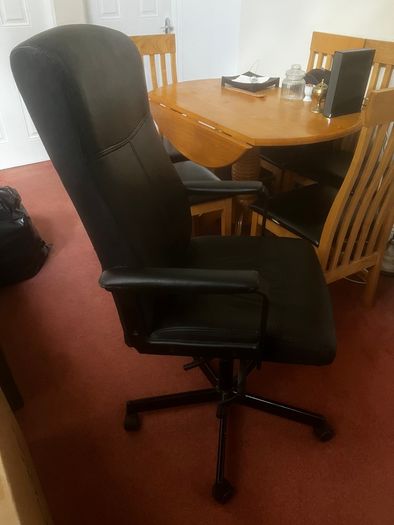 Ikea chair with one leg of the base broken