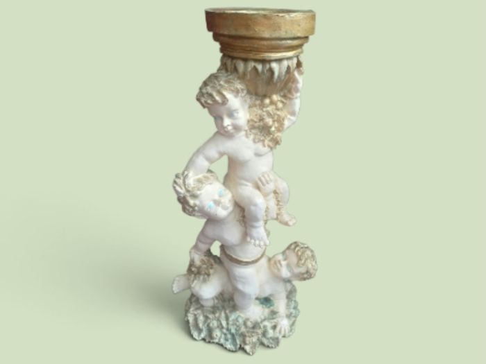 Ornate tall cherubic candle holder, D18