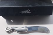 A collectible knife made of polished pewter with a stainless steel blade from Carrol Boyes.
