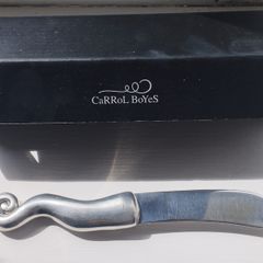 A collectible knife made of polished pewter with a stainless steel blade from Carrol Boyes.