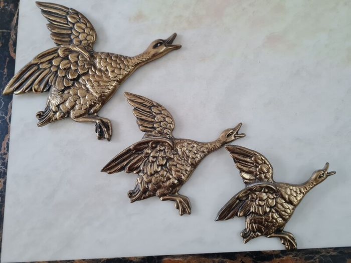brass flying ducks