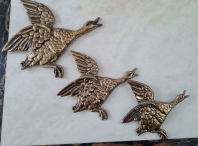 brass flying ducks