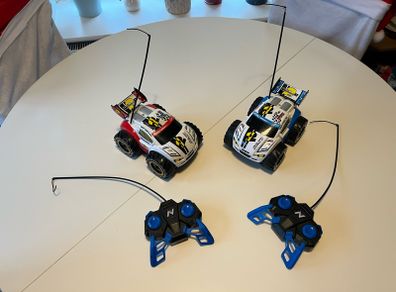 Perfectly working Twin set of Nikko Nano Vaporizr 2 remote controlled race cars- battery included- ready to use.