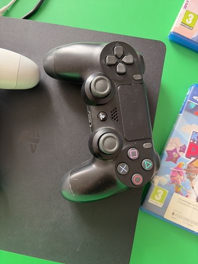playstation 4 with two controllers and games
