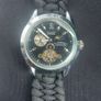 black dial  open-heart movement black paracord strap. Image 3