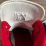 Nike Air Jordan 1 Mid trainers in the classic black, white and red colourway Image 4