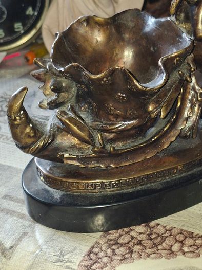 Antique French 19th century Bronze Sculpture Auguste Moreau featuring a Winged Putto Cherub Cupid carrying a shell or cornucopia like vessel, mounted on a marble base