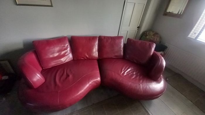 Red Leather curved sofa.. very large!