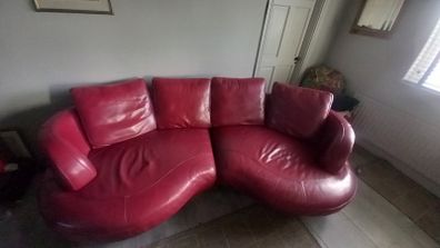 Red Leather curved sofa.. very large!