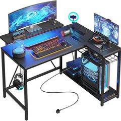 106.5CM L-Shaped Gaming Desk with RGB LED Lights Carbon Fibre Surface, 3 Power Outlets & 2 USB Ports, Reversible Corner Desk with Shelves & Hooks for Home Office & Small Spaces