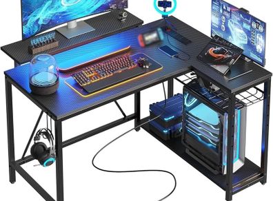 106.5CM L-Shaped Gaming Desk with RGB LED Lights Carbon Fibre Surface, 3 Power Outlets & 2 USB Ports, Reversible Corner Desk with Shelves & Hooks for Home Office & Small Spaces