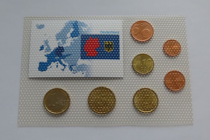 Colorized German euro coins set national tricolour flag