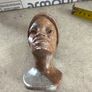 vintage image shows a handcrafted stone bust of a woman wearing a headscarf, often associated with Shona sculpture be carved from fruit serpentine stone from Zimbabwe Image 6