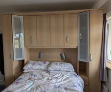 Bed surround wardrobe