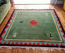 hand-knotted green Gabbeh rug