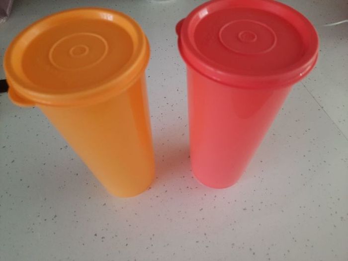 two tupperware jumbo Tumblers