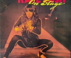 Rare and mint Japanese import. Kate Bush - On Stage. With four-page glossy insert featuring concert photos, Japanese liner notes and lyrics in both English & Japanese.