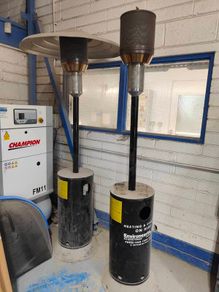 Commercial-grade patio heater suitable for outdoor commercial or residential use. Operates on propane or natural gas. Portable design with stable base. High heat output