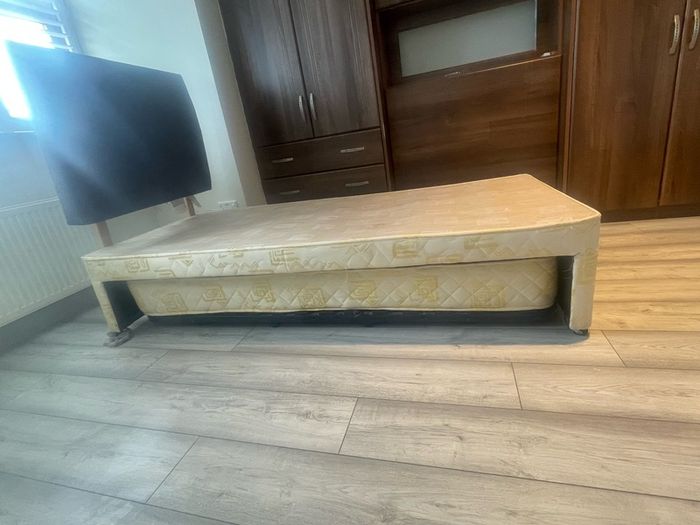 Single bed frame with guest mattress and headboard