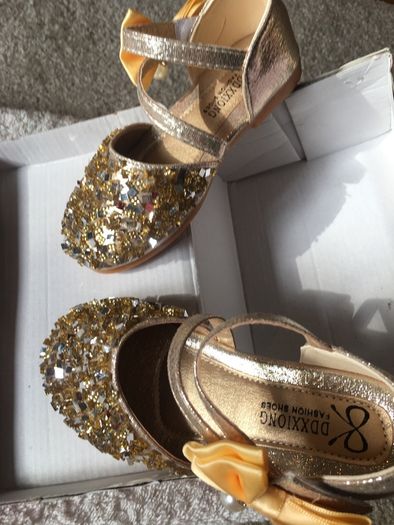. Brand new in box , pair of girls gold shoes