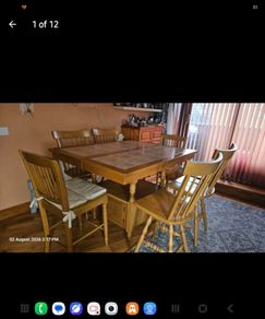 Solid oak extendable dining table with 6 chairs