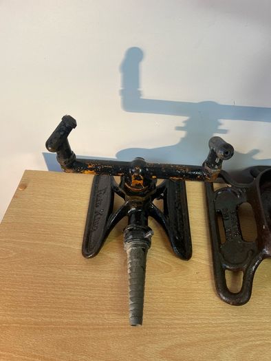 Two vintage rain king cast iron sprinklers