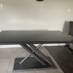 Glass top table and leather chairs