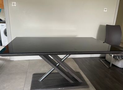 Glass top table and leather chairs