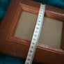 Hand-carved vintage wooden picture frame with a natural grain finish. Image 6