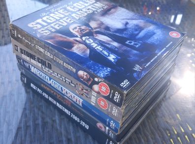 Lots of WWE wrestling DVDs, D18 post 7e, good condition