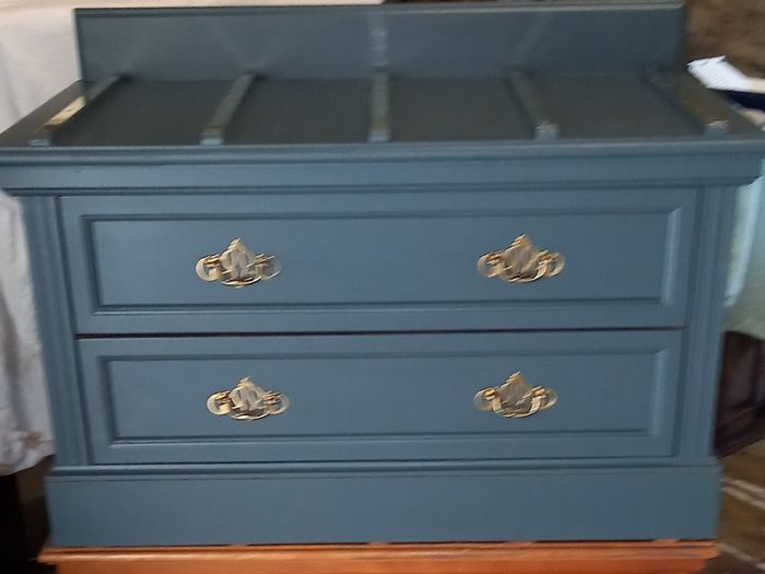 Chest drawers with brass strip suitcase set down
