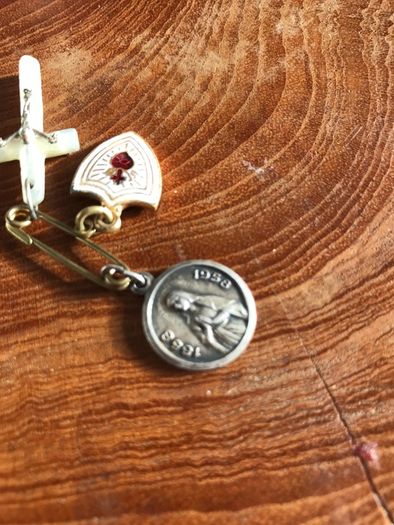 3 medals on a pin