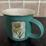 Brand Mew Mug with a Gold Rim and Floral Designs Image 4
