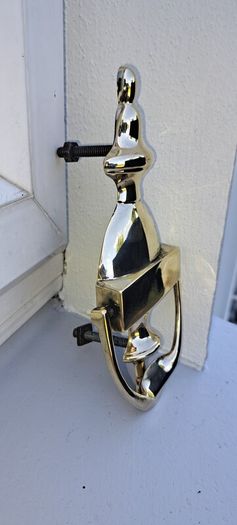 old brass door  striker