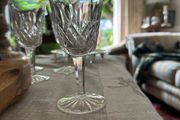 Four vintage Lismore pattern white wine glasses