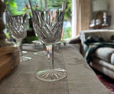 Four vintage Lismore pattern white wine glasses