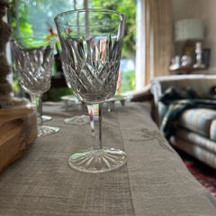 Four vintage Lismore pattern white wine glasses
