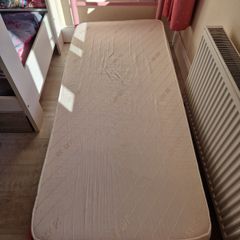 Pink metal frame toddler bed