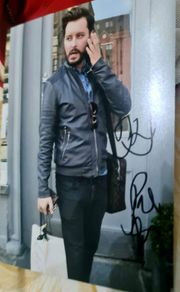 A signed 6x4 photo Brian Dowling