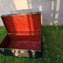 Black storage trunk with red patterned lining Image 2