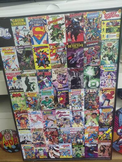 large wooden framed super heroes and villans wall hanging and 2 metal wallhanging discs