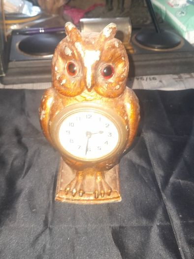 Cold Painted Bronze Clock In Form Of An Owl. The Decorative Dial Sits In The Owls Belly And Has Wind Up Movement,