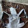 Baby feeding high chair + ergobaby child carrier. Image 4