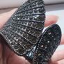 A striking wide bracelet encrusted with sparkling rhinestones. Image 2