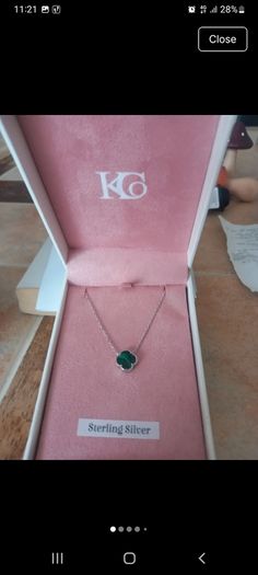 silver necklace with green stone